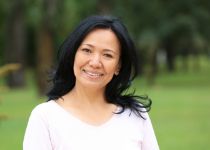 Smiling man and woman in gray sweaters