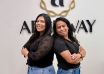 Doctor Henkin laughing with a dental patient