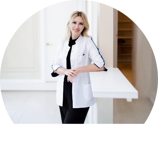 Doctor Henkin wearing dental binoculars while treating a patient